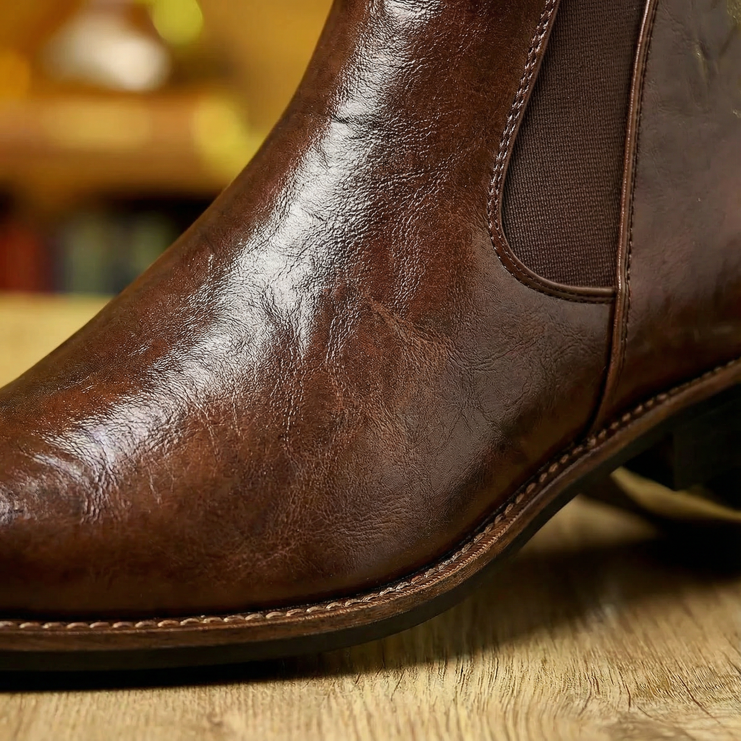 Black full-grain leather men's Chelsea boots, classic slip-on ankle style for modern men's fashion.