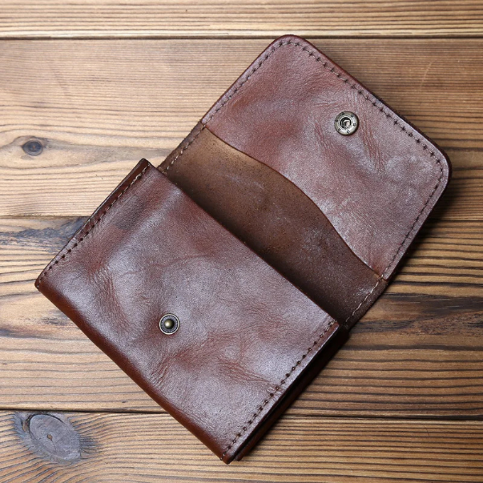 Close-up of a men's durable full-grain leather trifold wallet, showcasing classic style & secure design.