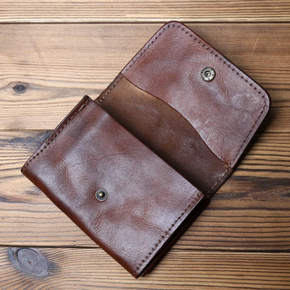 Close-up of a men's durable full-grain leather trifold wallet, showcasing classic style & secure design.