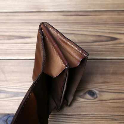 Secure men's full-grain leather trifold wallet, offering ample space and a timeless classic design.
