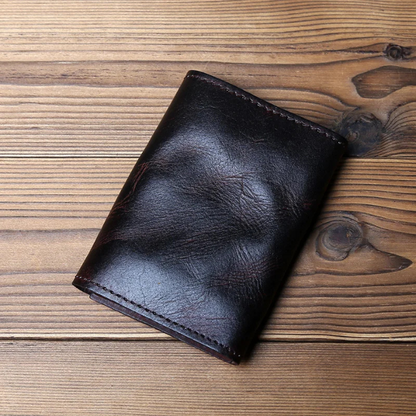 Men's durable full-grain leather trifold wallet, featuring a classic design for secure everyday carry.