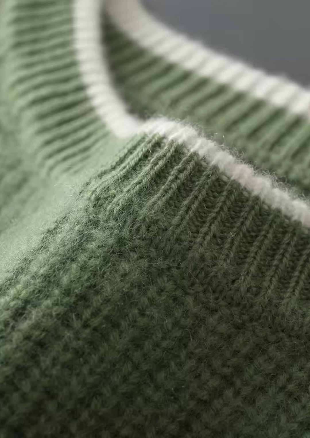 Side profile of a man wearing an elegant and versatile crew neck knitted sweater.