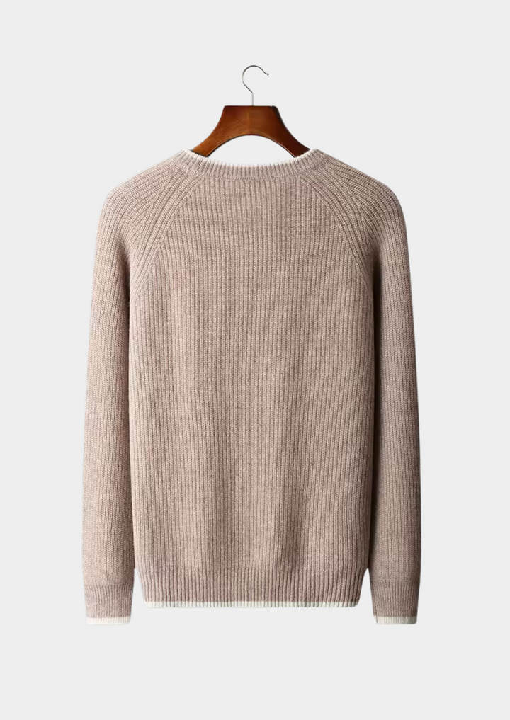 Close-up of a soft-textured men's elegant crew neck knitted sweater, highlighting quality.
