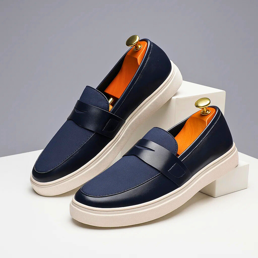 Stylish men's navy Italian penny loafers, perfect slip-on shoes for casual or dressy occasions.