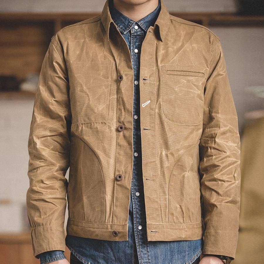 Detailed shot of the cotton fabric on a men's classic khaki casual jacket.