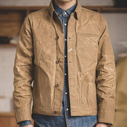Detailed shot of the cotton fabric on a men's classic khaki casual jacket.