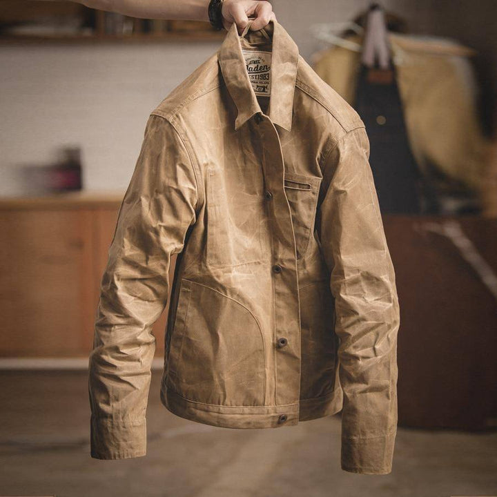 Side profile of a men's khaki outerwear jacket, highlighting its casual yet timeless design.