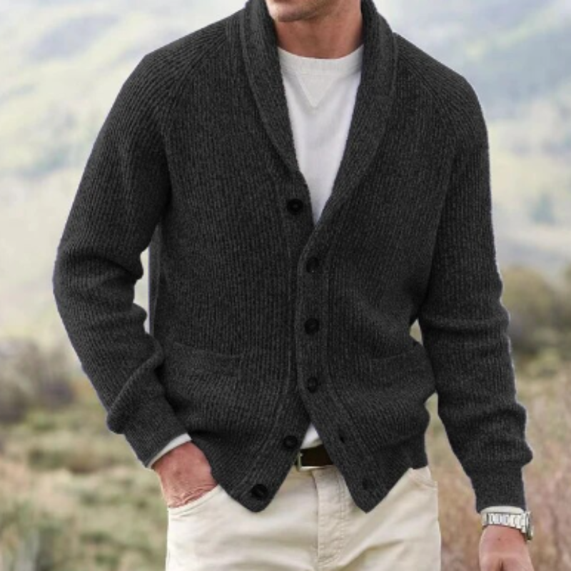 Cozy men's knit cardigan sweater, button-up style with a sophisticated shawl collar for fall and winter fashion.