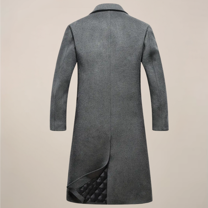 Stylish man wearing a classic black long overcoat with a tailored fit, ideal for business casual or elegant fall fashion.