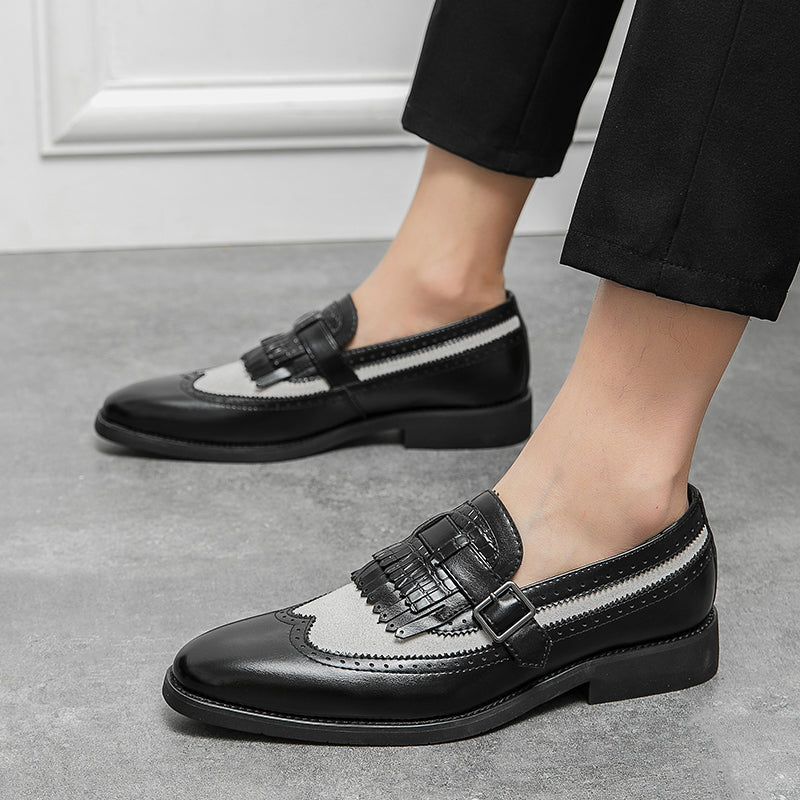 Modern classic men's slip-on loafers, combining brogue detailing with an elegant fringe.
