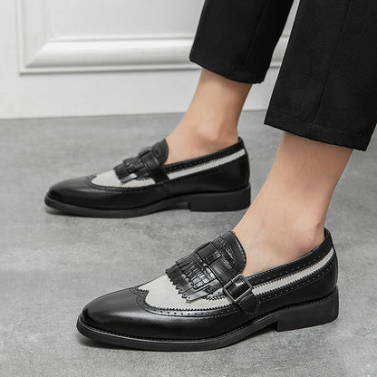 Modern classic men's slip-on loafers, combining brogue detailing with an elegant fringe.