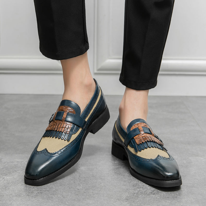 Luxury men's formal shoes: classic brogue loafers with a refined fringe and wingtip design.