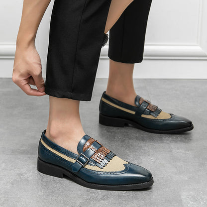 Men's sophisticated slip-on loafers with brogue perforations and a tasteful fringe detail.
