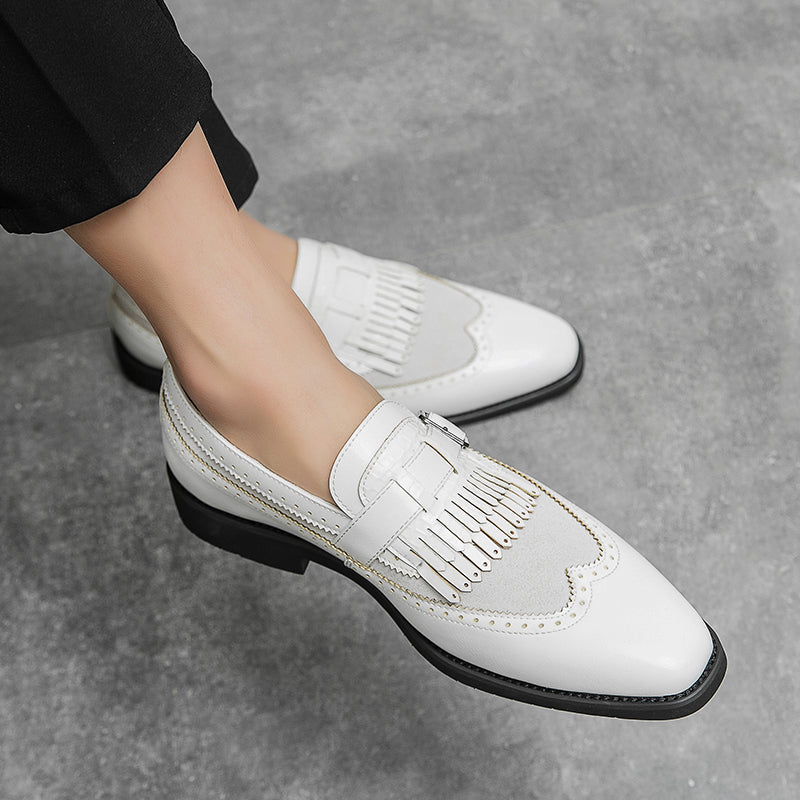 Men's formal leather loafers featuring brogue design and decorative fringe, for a polished appearance.