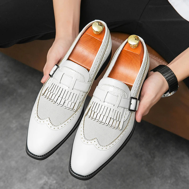 Classic men's brown leather loafers, designed with brogue accents and decorative fringe.