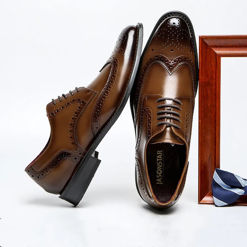 Men's classic Oxford brogues paired with a suit, illustrating sophisticated men's fashion and formal wear.