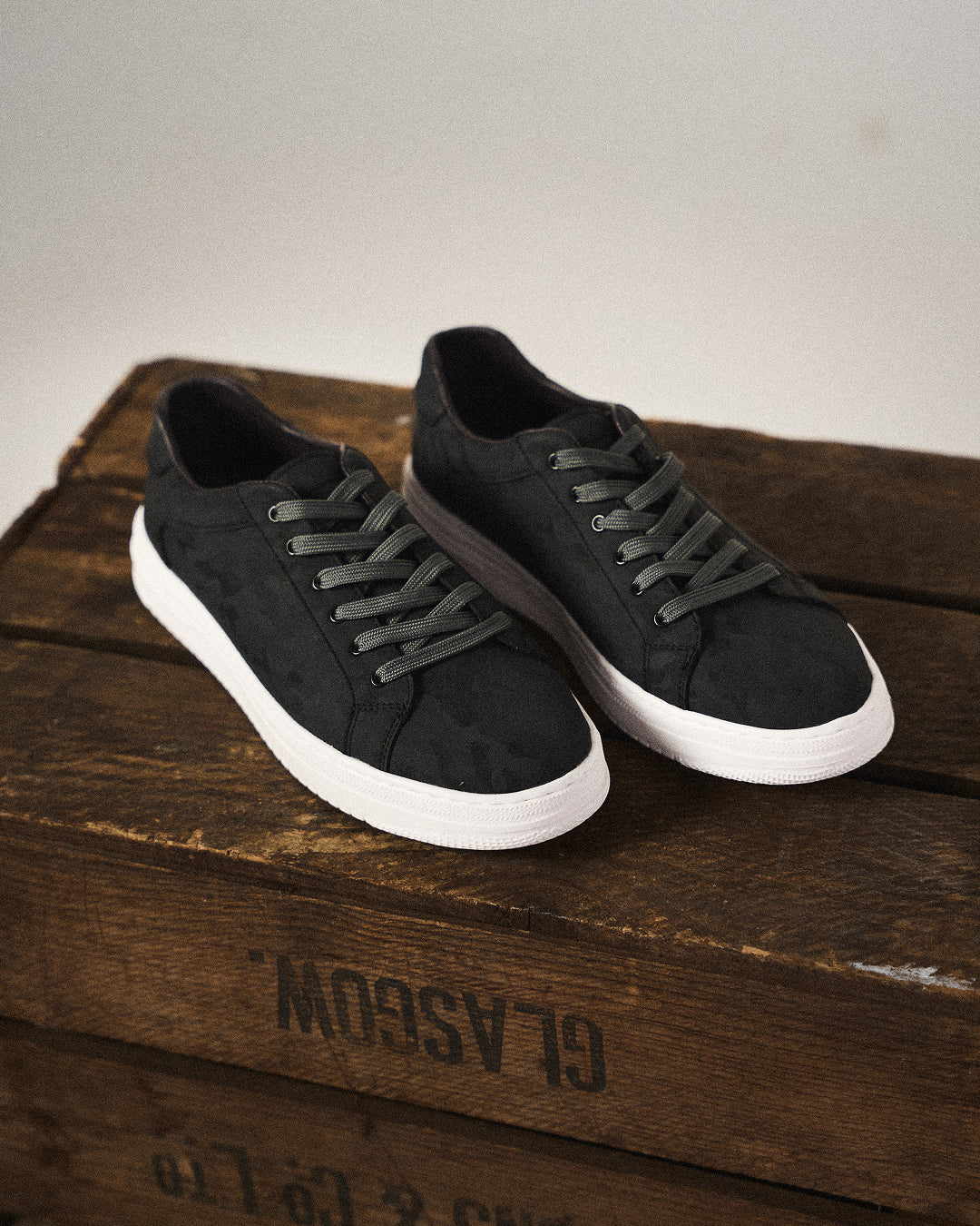 Black men's classic leather sneakers. Stylish, comfortable casual shoes for everyday wear.