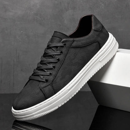 Stylish men's classic leather sneakers. Versatile casual leather footwear in black, white & sand options.