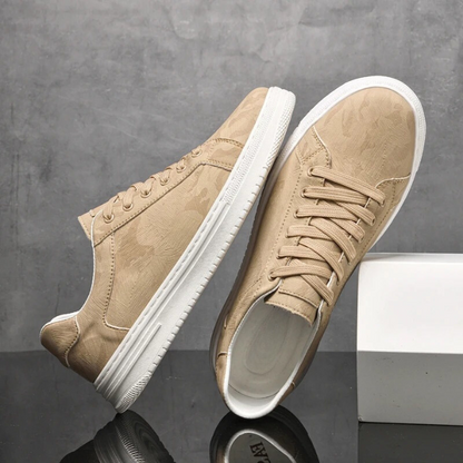 White men's classic leather sneakers on foot, showcasing comfortable, stylish everyday casual wear.
