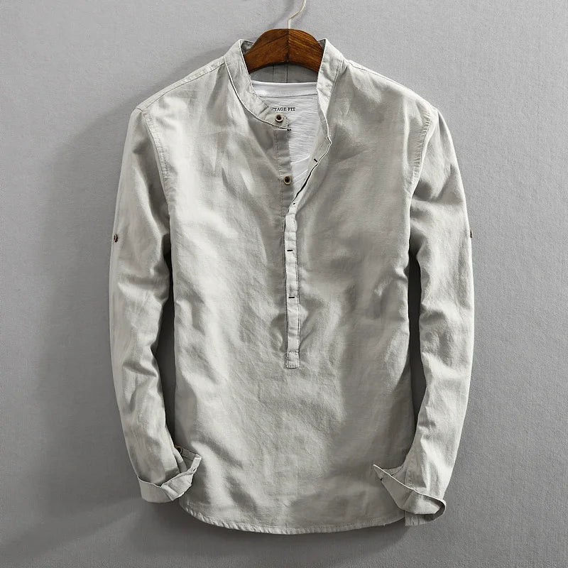 Men's classic long-sleeve button-up shirt in a versatile solid color, perfect for comfortable everyday wear.