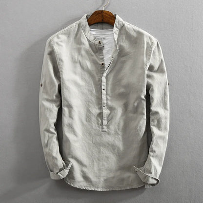 Men's classic long-sleeve button-up shirt in a versatile solid color, perfect for comfortable everyday wear.