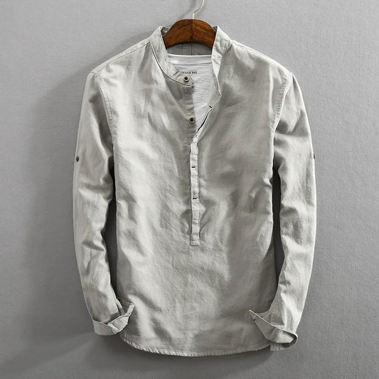Men's classic long-sleeve button-up shirt in a versatile solid color, perfect for comfortable everyday wear.