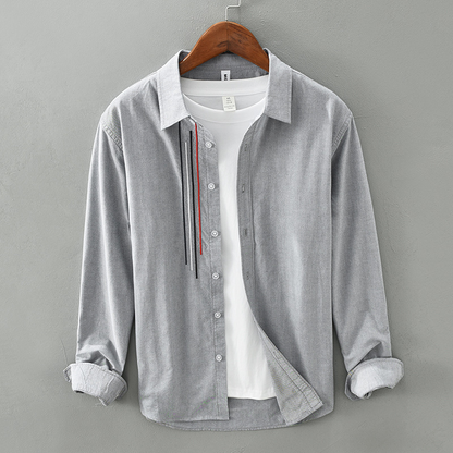 Comfortable men's long-sleeve button-up shirt for casual wear. Soft fabric, versatile for spring & fall outfits.