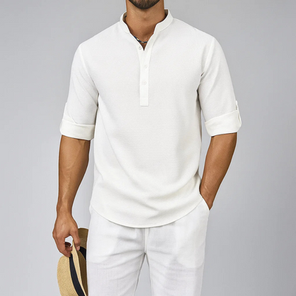 Versatile men's Henley shirt with a relaxed hem, designed for everyday comfort & effortless casual men's fashion.