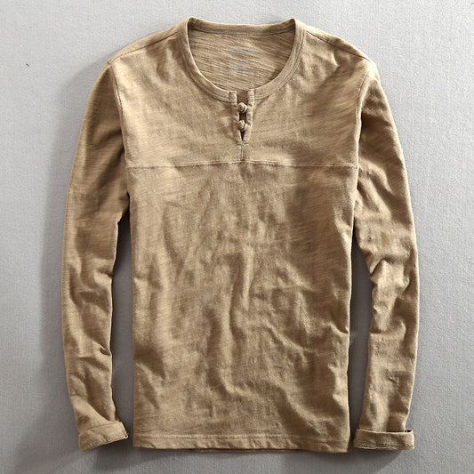 Men's classic long sleeve Henley shirt in gray, perfect for casual wear and everyday comfort. A versatile wardrobe essential.