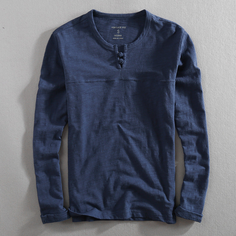 Stylish men's Henley shirt with buttons, offering effortless style. Ideal for versatile casual wear & men's fashion.