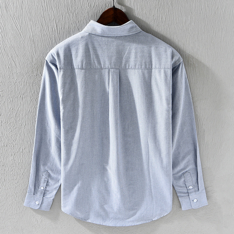 Men's dress shirt alternative: classic Oxford, long sleeve, featuring distinctive ribbon trim for a unique touch.