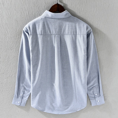 Men's dress shirt alternative: classic Oxford, long sleeve, featuring distinctive ribbon trim for a unique touch.