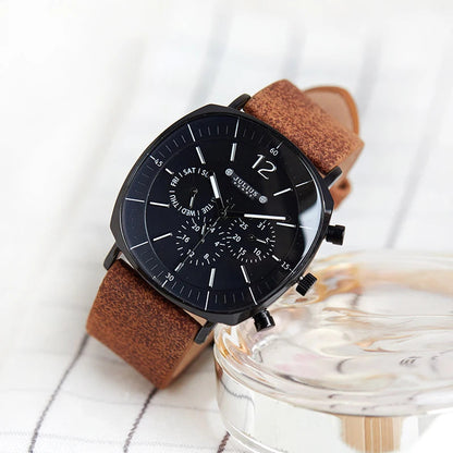 Close-up of men's formal chronograph watch dial. Shows precise quartz movement, sub-dials, and elegant markers.