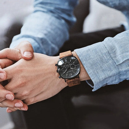 Stylish men's analog watch on a wrist. A classic chronograph with a comfortable leather strap, perfect for formal wear.