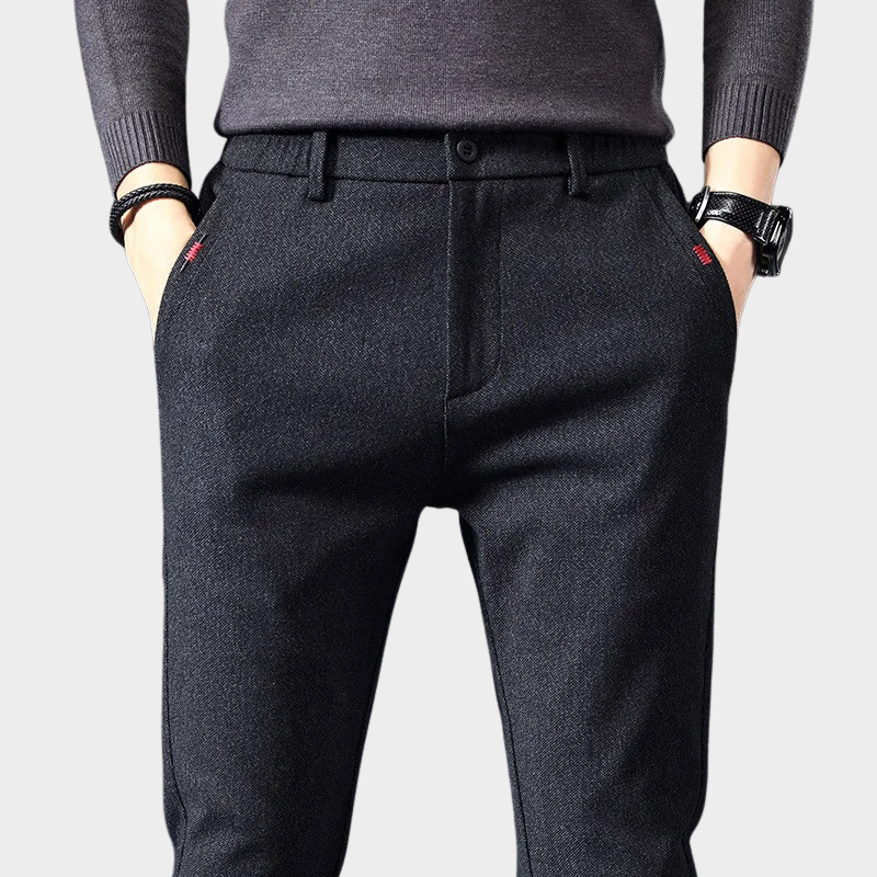 Man in versatile men's classic slim fit pants, pairing them for smart casual look, highlighting comfort & modern style.