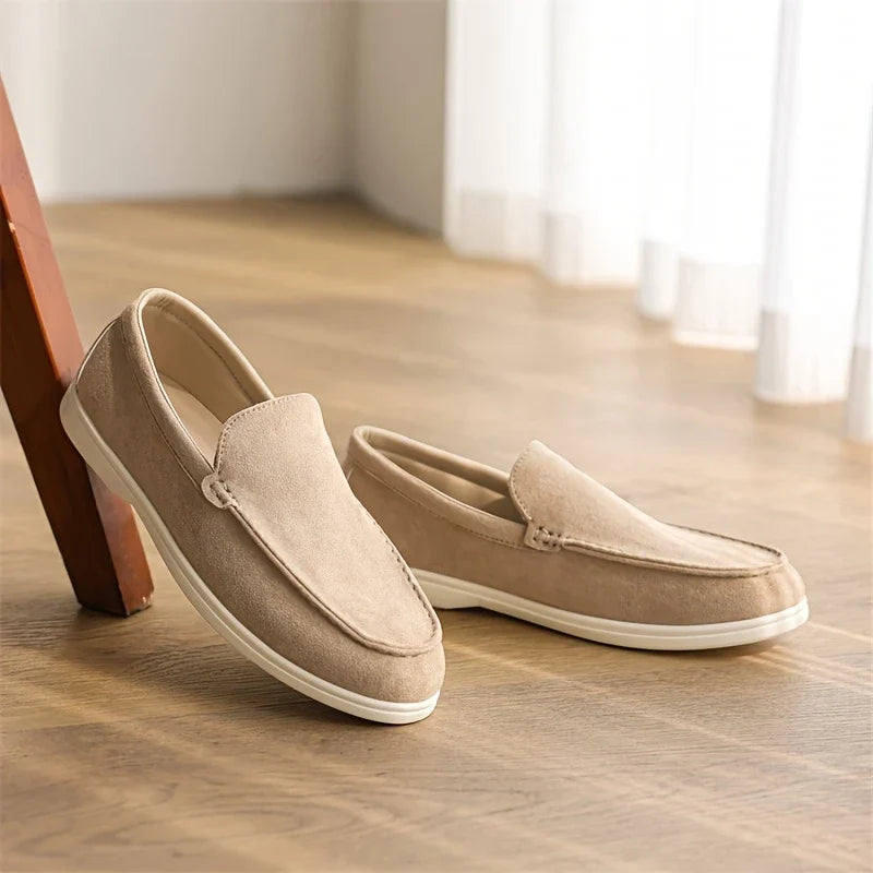 Pale blue men's slip-on loafers, stylish comfort footwear for casual outfits and easy wear.