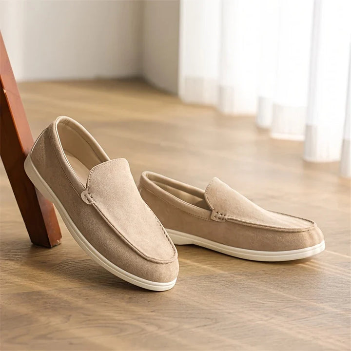 Pale blue men's slip-on loafers, stylish comfort footwear for casual outfits and easy wear.