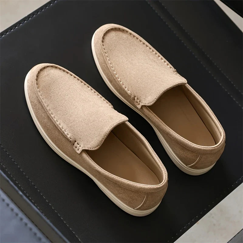 Close-up of comfortable men's classic slip-on loafers, highlighting detailed texture & quality.