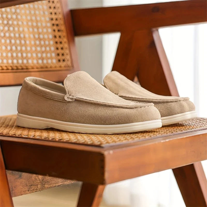 Men's slip-on loafers on foot, showcasing comfortable everyday casual footwear style.