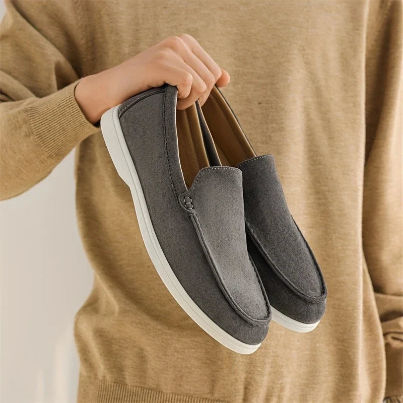 Side view of men's classic comfort loafers, versatile slip-on shoes for various occasions.
