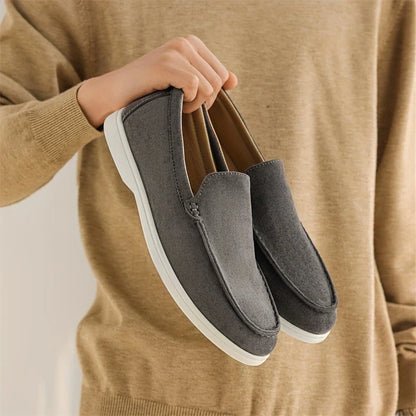 Side view of men's classic comfort loafers, versatile slip-on shoes for various occasions.
