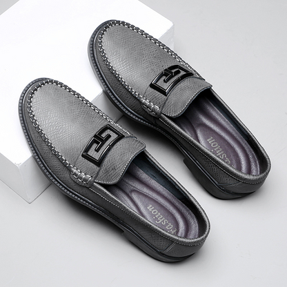 Side profile of classic men's loafers, showcasing their elegant slip-on design and comfortable fit.