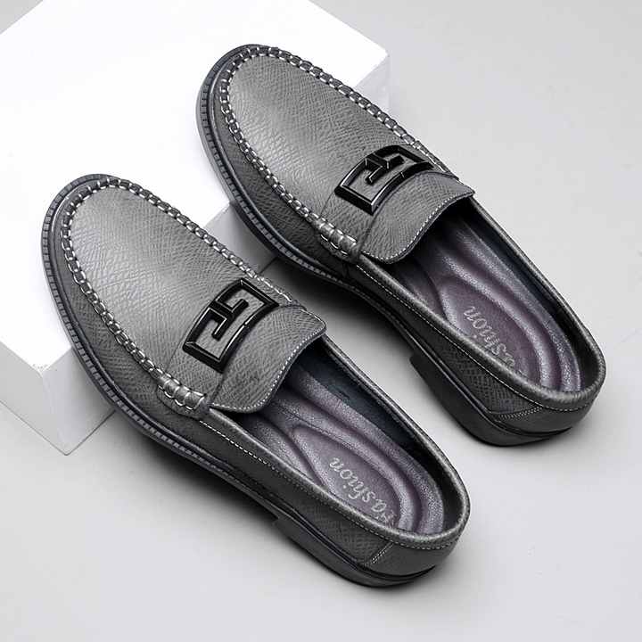 Side profile of classic men's loafers, showcasing their elegant slip-on design and comfortable fit.