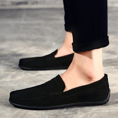 Men's slip-on loafers in brown, black, and navy options, offering comfort, durability & style.
