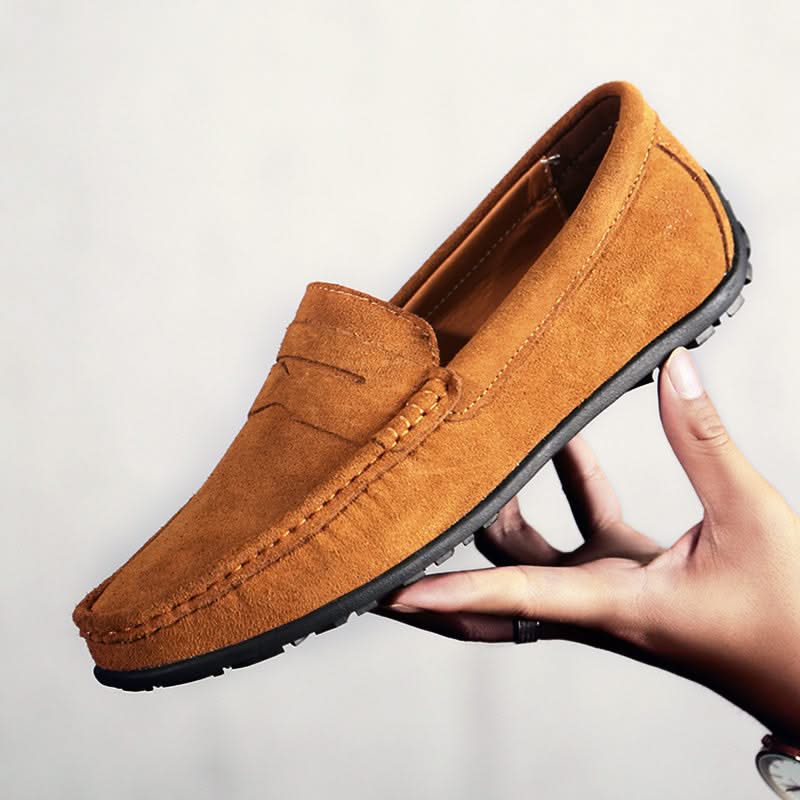 Stylish brown leather men's slip-on loafers, perfect for casual or dressy outfits.