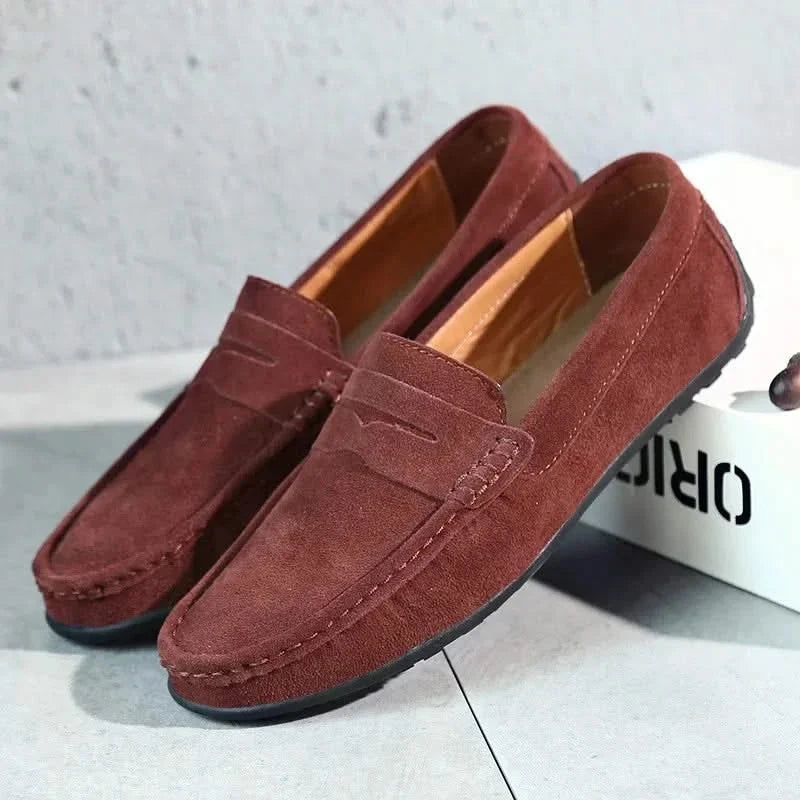 Versatile navy blue men's slip-on loafers, ideal for casual wear or smart-casual looks.