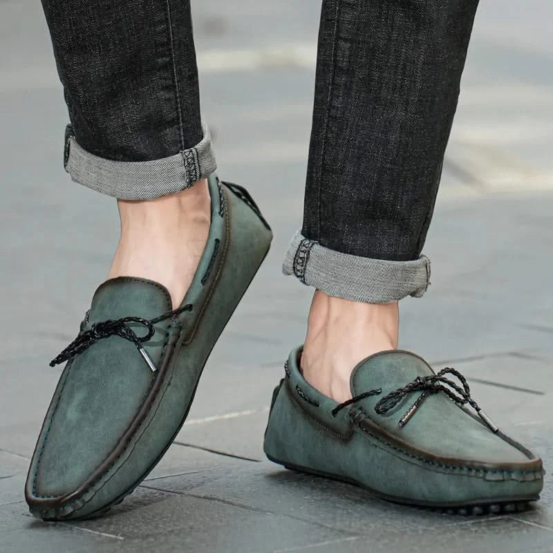 Classic men's loafers featuring moccasin stitching & comfortable design, suitable for versatile casual & dress wear.