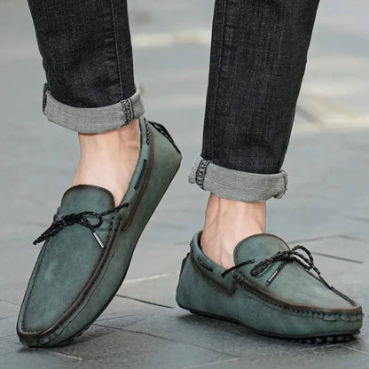 Classic men's loafers featuring moccasin stitching & comfortable design, suitable for versatile casual & dress wear.