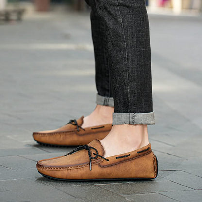 Durable men's slip-on loafers for everyday wear, providing comfort, classic style, and a reliable traction sole.