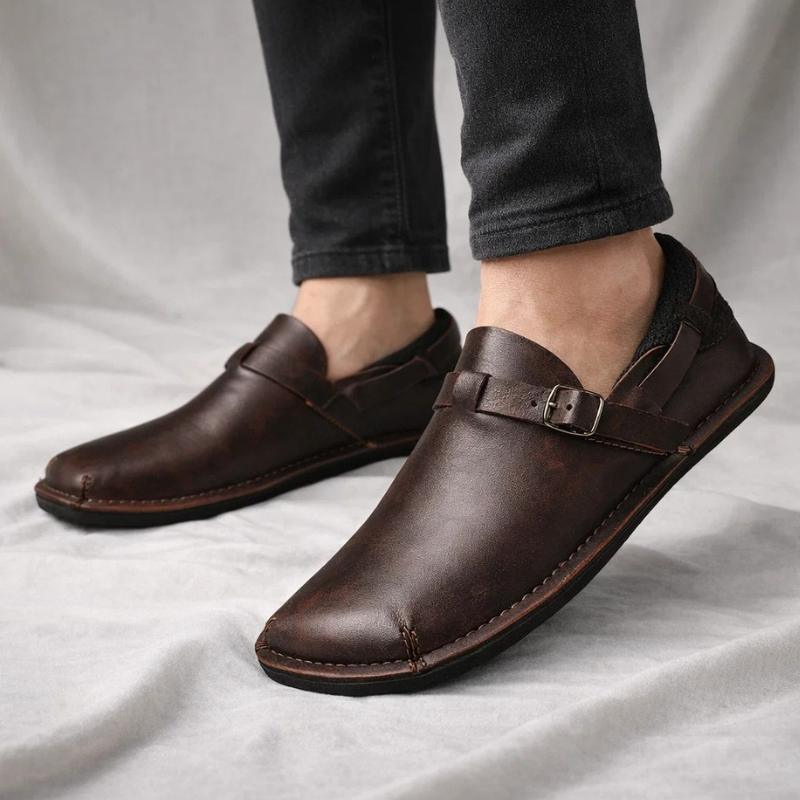 Stylish brown leather men's slip-on loafers, classic comfortable dress footwear for versatile wear.